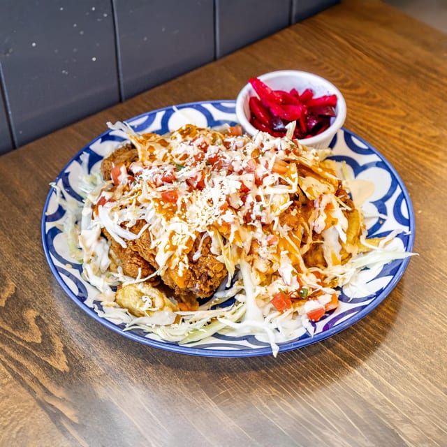 Pollo Con Tajadas.